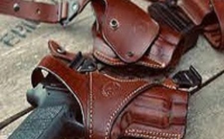 How do custom leather holsters offer superior retention features?